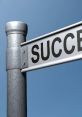 Street sign with the word "SUCCESS," symbolizing achievement and personal growth against a clear blue sky.