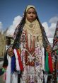 Siwan woman in traditional dress, showcasing intricate embroidery and vibrant colors, reflecting Siwa's rich cultural heritage.