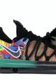 Nike "What The" sneakers featuring a vibrant multicolor design and textured black accents for a striking athletic look.