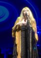 Gold Dust Woman The haunting melody of "Gold Dust Woman" fills the room, the ethereal voice of Stevie Nicks crooning the