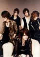 The Gazette As you listen to the of The Gazette, you are immediately captivated by the hauntingly beautiful that emanate