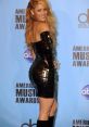 Shakira dazzling in a stunning black dress at the American Music Awards, showcasing her captivating style and charisma.