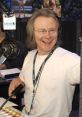 Fred Norris smiling while broadcasting at Sirius XM, showcasing his engaging personality and radio expertise.