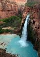 Waterfall The of a waterfall is truly a natural wonder. The rushing water crashes down over rocks and cliffs, creating a