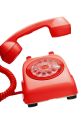 Bright red rotary phone with curly cord, perfect for vintage decor and capturing the nostalgic essence of the phone ringing.