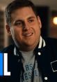 Nick Burns smiles while wearing a varsity jacket, reflecting his charismatic personality in a casual setting.