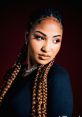 Shenseea Shenseea is known for her distinctive voice that brings a unique to the dancehall scene. Mixing elements of