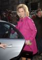 Cheerful woman in a pink coat exiting a car, promoting freshness and style, ideal for a Brita advert setting.