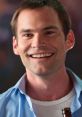 Smiling man in a light blue shirt holding a beer, embodying the fun, carefree spirit of Steve Stifler from American Pie.