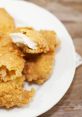 Crispy The of sizzling in the kitchen filled the air as the chef carefully fried up a batch of crispy golden chicken.