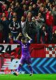 Goalkeeper celebrates with fans at a vibrant football match, embodying the spirit of Football Club songs and camaraderie.