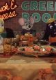 Chuck E. Cheese characters gather for a festive meal in the Green Room, featuring autumn decorations and themed treats.