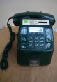 Green coin-operated telephone with keypad and instructions, ideal for public use and vintage telecommunication settings.