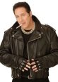 Andrew Dice Clay in a black leather jacket, smoking a cigarette, showcasing his iconic tough look and rockstar attitude.