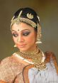 Shobana Shobana's graceful movements on stage are accompanied by the melodious of a classical Bharatanatyam piece. The soft