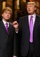 Alec Baldwin performs a comedic skit portraying Donald Trump, featuring matching suits and vibrant purple ties.