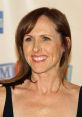 Molly Shannon smiling at an event, showcasing her vibrant personality connected to "A Night At The Roxbury.