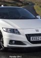 Sleek Honda CR-Z showcased on a scenic road, highlighting its sporty design and performance features. Perfect for car enthusiasts.