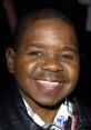 Gary Coleman smiles warmly, showcasing his iconic look and personality, a beloved figure in classic television history.