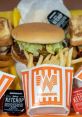 Delicious Whataburger meal featuring a burger, crispy fries, and spicy ketchup, showcasing iconic fast-food flavors.