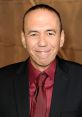 Gilbert Gottfried smiles in a formal attire, showcasing his signature humor and charm at a public event.