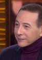 Pee-Wee Herman discusses his career and iconic character in a candid interview, showcasing his signature style and charm.