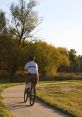 Bike Ride The of a group of riders getting ready for a bike ride is a symphony of clicking gears,ueaking brakes, and