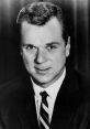 Classic black and white portrait of a man in a suit, reminiscent of vintage Hollywood charm and charisma.