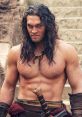 Jason Momoa as Conan the Barbarian, showcasing his muscular physique and intense expression, embodying fierce warrior spirit.