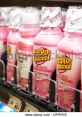 Pepto-Bismol bottles displayed on a shelf, promoting relief for multiple digestive symptoms like heartburn and upset stomach.