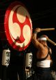 Taiko The powerful thuds of the taiko drums echo through the air, reverberating off the walls of the practice hall. Each