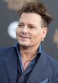 Johnny Depp smiling at a red carpet event, wearing a stylish suit with unique hair and accessories, showcasing his charisma.