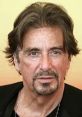 Al Pacino with stylish hair and a serious expression, best known for iconic roles in classic films.