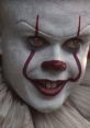 Pennywise from IT features menacing gaze, iconic red markings, and eerie smile, capturing the essence of fear.