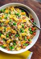 Colorful quinoa salad with pineapple, peas, and bell peppers, perfect for a healthy meal. Ideal for Raisin Bran advertising.