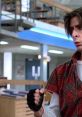 Judd Nelson as John Bender in "The Breakfast Club," showcasing his rebellious character in an iconic high school setting.