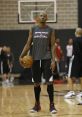 Ray Allen in Miami Heat gear holding a basketball, showcasing focus during an NBA training session.