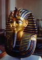 Golden burial mask of Tutankhamun, showcasing vibrant blue and gold details, symbolizing ancient Egyptian artistry.