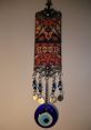 Colorful traditional talisman with blue eye motifs and intricate patterns, offering protection against the evil eye.