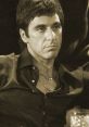 Tony Montana portrayed by Al Pacino in a classic scene, embodying the iconic character from Scarface.