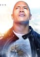 Dwayne Johnson looks confidently upward, wearing a leather jacket and a graphic tee, embodying strength and determination.