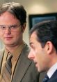 Dwight Schrute and Michael Scott share a moment, highlighting their dynamic in the iconic TV show, "The Office.