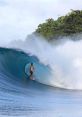 Surfer riding a powerful wave, showcasing the thrill of natural waves in a stunning ocean setting.