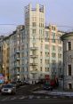 Historic Soviet-era building in Moscow, showcasing unique architecture and urban landscape near a busy intersection.