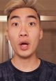 Surprised expression of RiceGum in a bathroom setting, showcasing his distinct style and engaging personality.