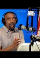 Jesse Lee Peterson discussing topics on his talk show, emphasizing freedom of speech with a microphone and a blue background.