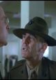 Sergeant Hartman confronts a recruit, showcasing intense military discipline in a classic prank call scene.