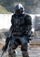 UNSC Halo Marine in tactical armor, equipped with a weapon and gear, navigating a rugged environment.