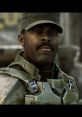 Sergeant Avery Johnson from Halo, wearing UNSC armor and a cap, gazes confidently amidst a battle scene.