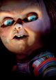 Chucky doll with striking blue eyes and mischievous expression, embodying the essence of prank calls and horror.